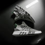 grayscale photo pair of adidas shoes